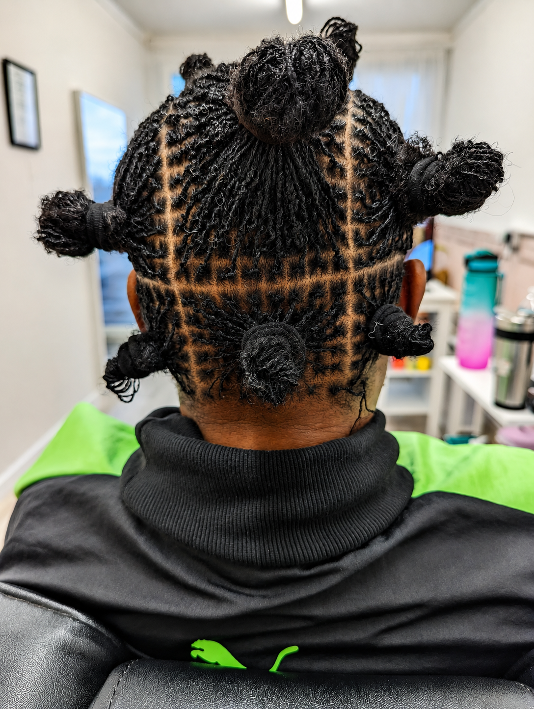 Bantu knots over microlocs - Trendylocs protective styling